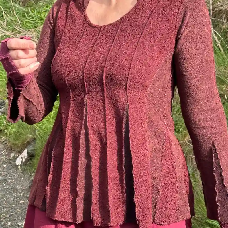 A Feeline Clothing fine fleece top in russet with contrasting inserts of a paler russet shade.