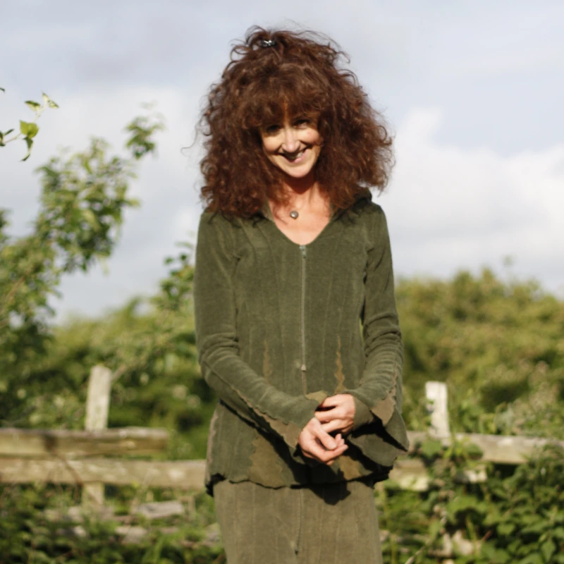 Feeline Clothing cardigan/jacket in forest colour way, modelled in a garden setting