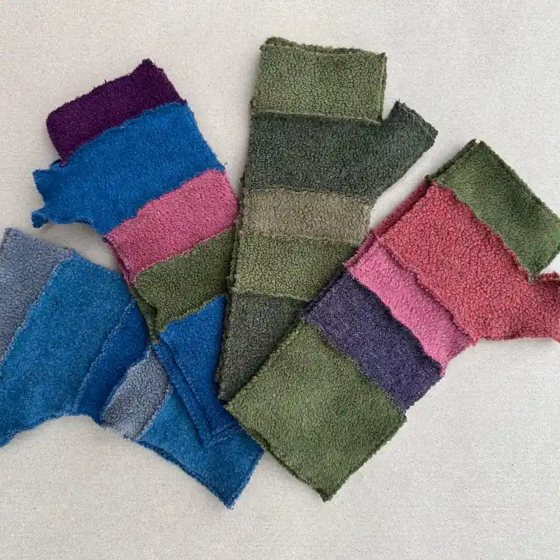4 pairs of Feeline Clothing striped mittens, in multi colours. pink, green, blue, grey.