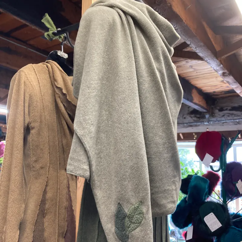 Feeline Clothing garments on mannequins in Salt Cellar Workshops, in Porthleven, Cornwall